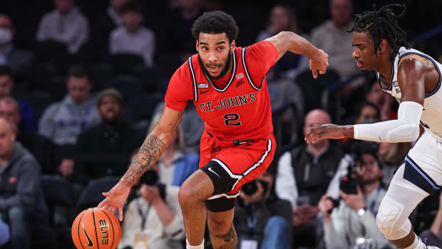 St. John's Red Storm guard Julian Champagnie (2) dribbles up court against Villanova Wildcats forward Brandon Slater (3) during the first half at Madison Square Garden.